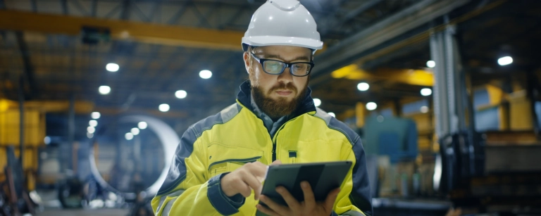 construction worker on tablet